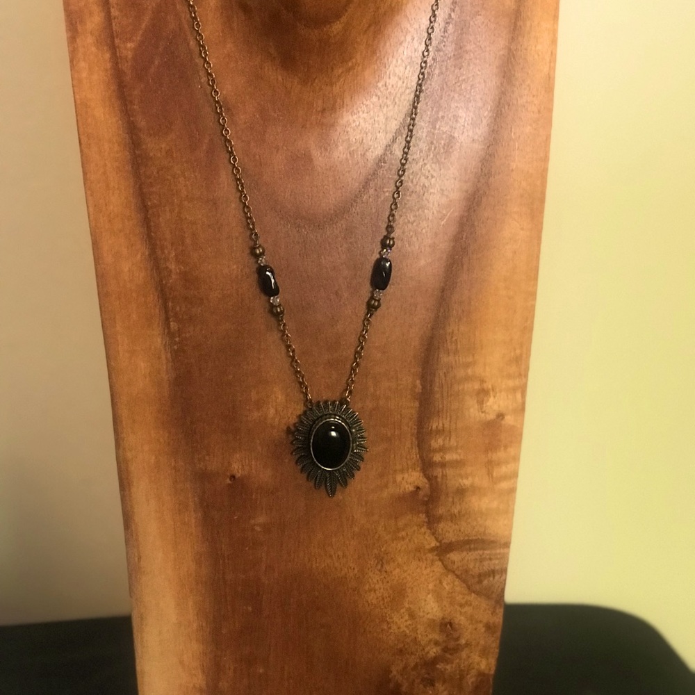 Necklace 14” chain with black stone that opens